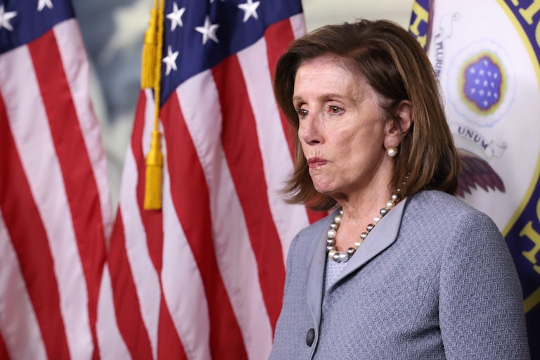 Nancy Pelosi grimaces at a press conference on Capitol Hill.
