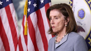Nancy Pelosi grimaces at a press conference on Capitol Hill.