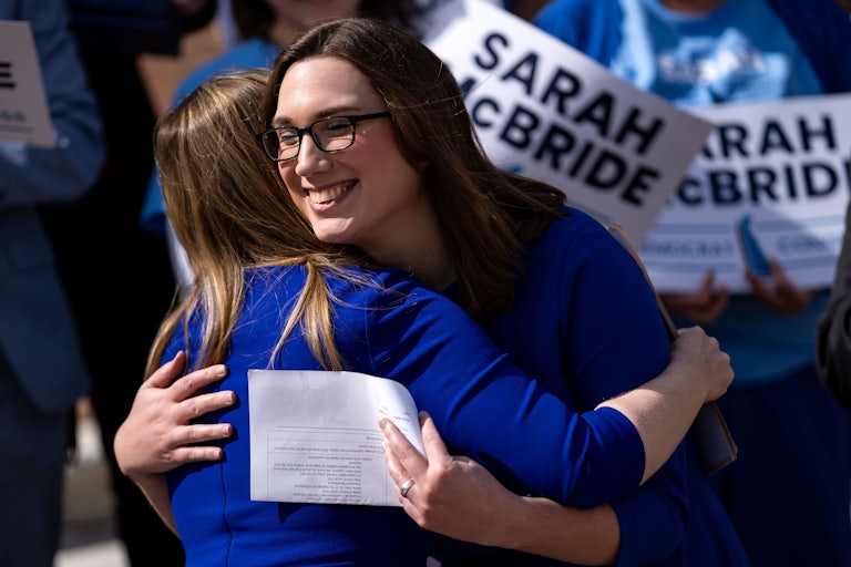Delaware's Sarah McBride hugs someone