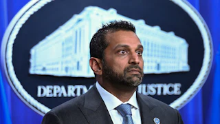 FBI Director Kash Patel stands during a press conference