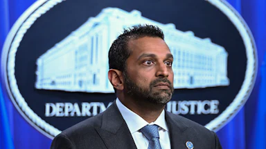 FBI Director Kash Patel stands during a press conference