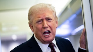 Donald Trump speaks vehemently while standing on Air Force One