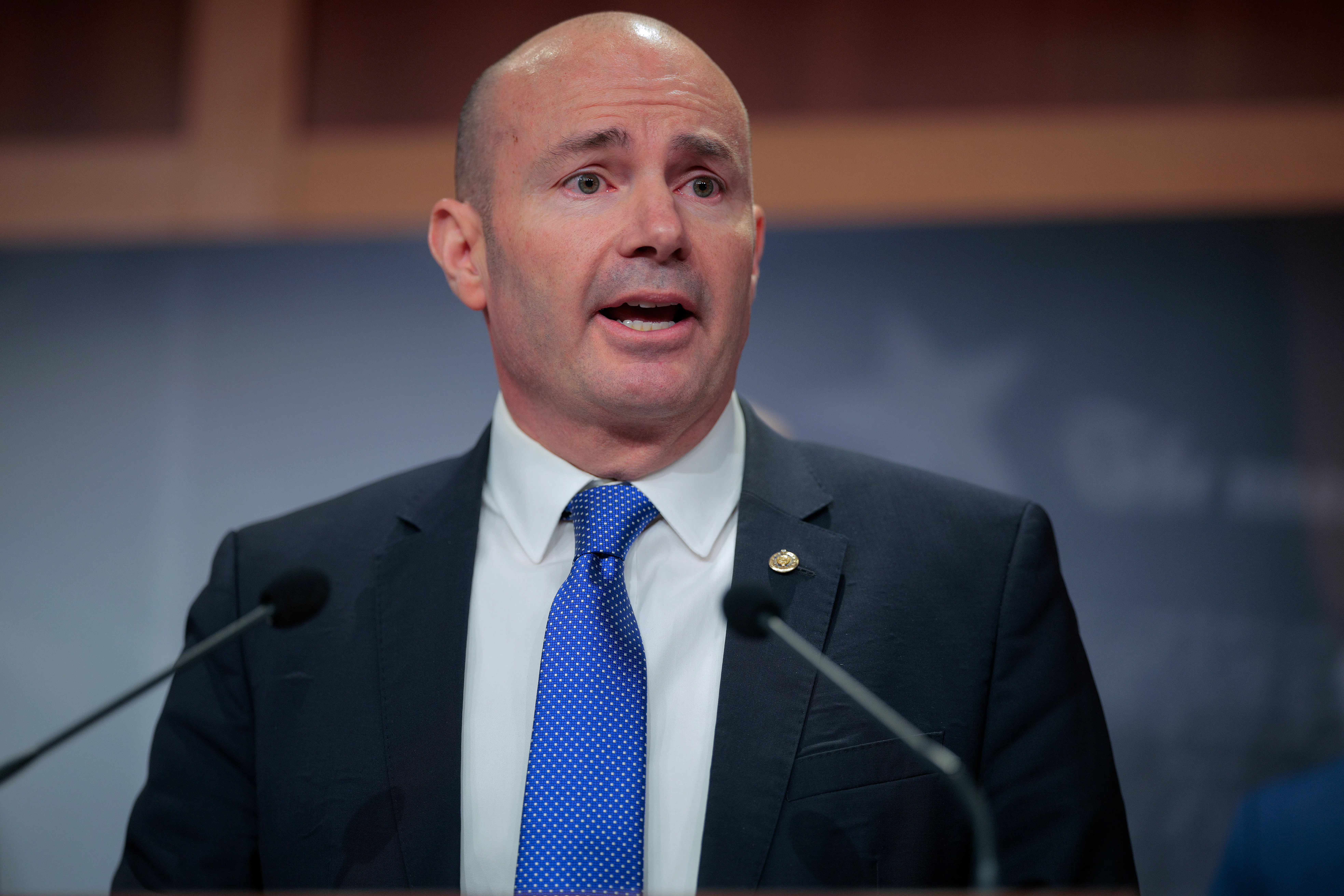 Senator Mike Lee speaks at a podium