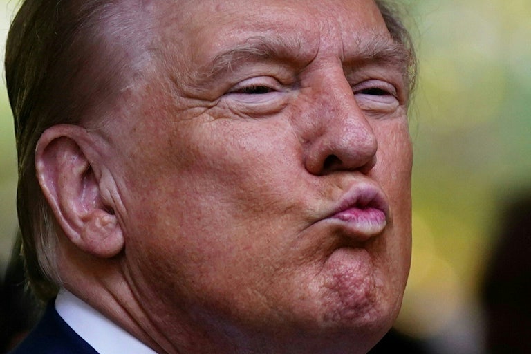 Donald Trump purses his lips while at a 9/11 memorial service