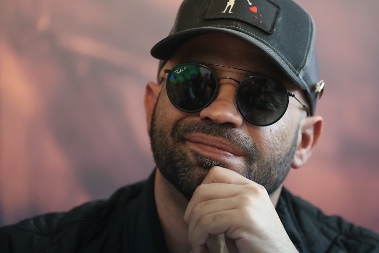 Enrique Tarrio smiles during a press conference