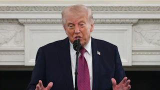 Donald Trump delivers a speech at a podium