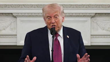 Donald Trump delivers a speech at a podium