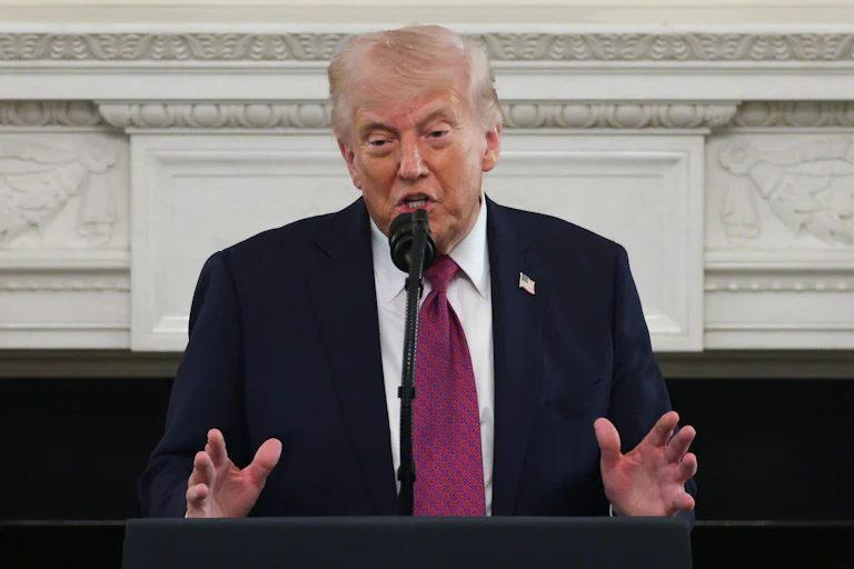 Donald Trump delivers a speech at a podium