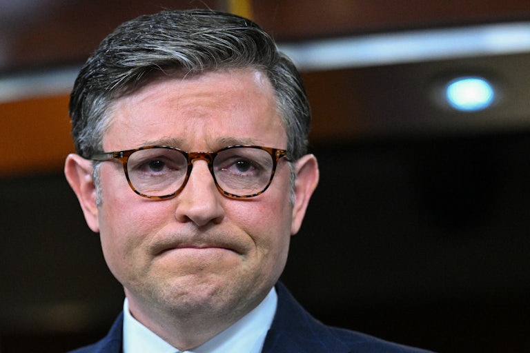 House Speaker Mike Johnson purses his lips into a frown