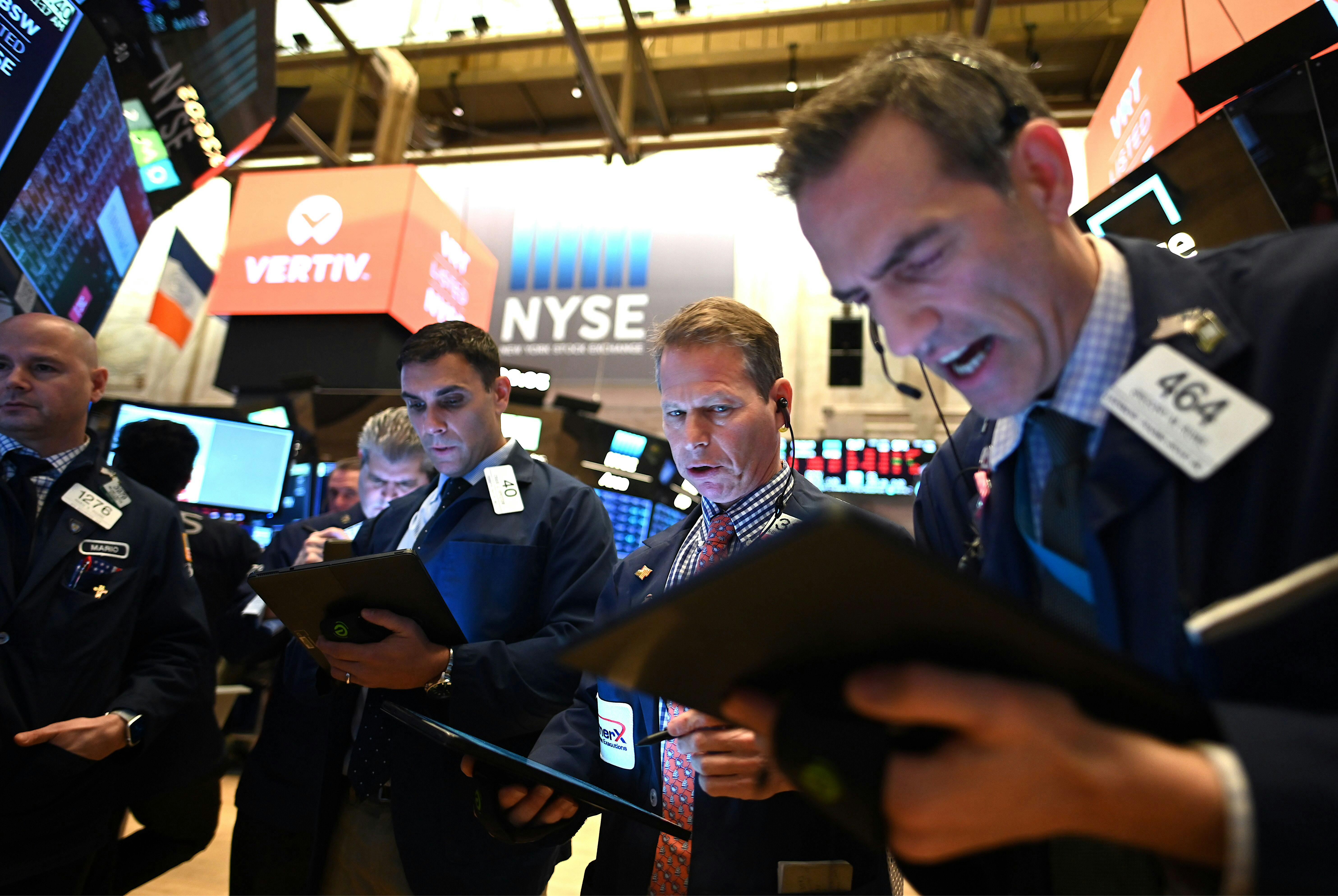 Traders work during the opening bell at the New York Stock Exchange.