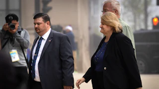 Hannah Dugan walks into court