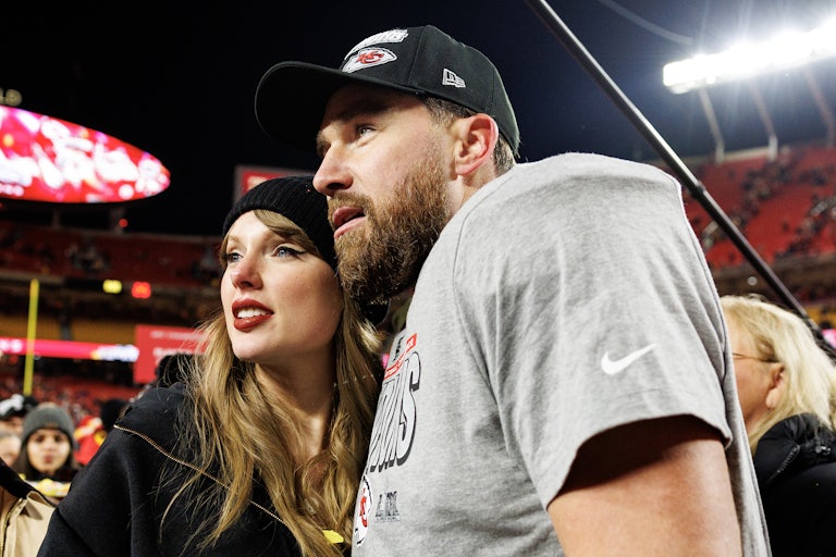Taylor Swift and Travis Kelce pose together after the AFC Championship game against the Buffalo Bills in January in Kansas City, Missouri.