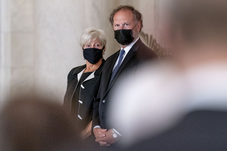 Martha-Ann Alito and Samuel Alito stand next to each other, wearing masks
