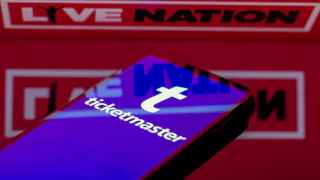 Phone with Ticketmaster in front of a Live Nation logo