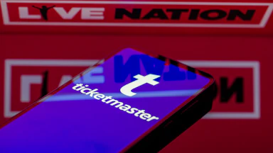 Phone with Ticketmaster in front of a Live Nation logo