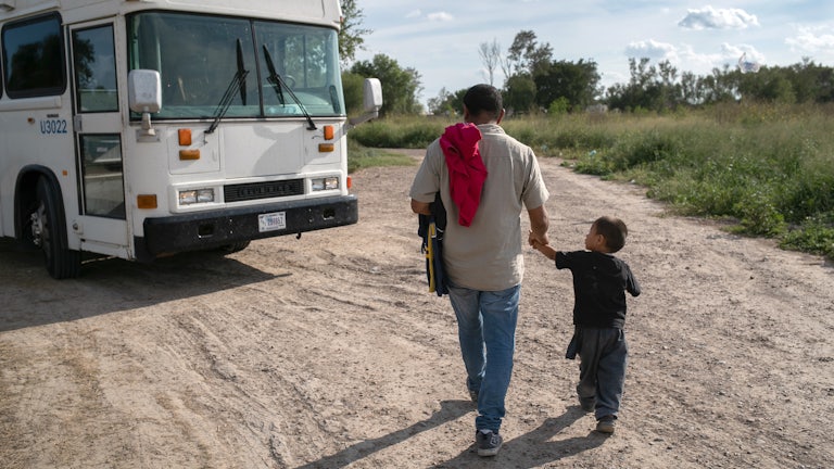 A 3 year old unaccompanied minor from Honduras waits to be bussed to a U.S. Border Patrol facility in Texas.