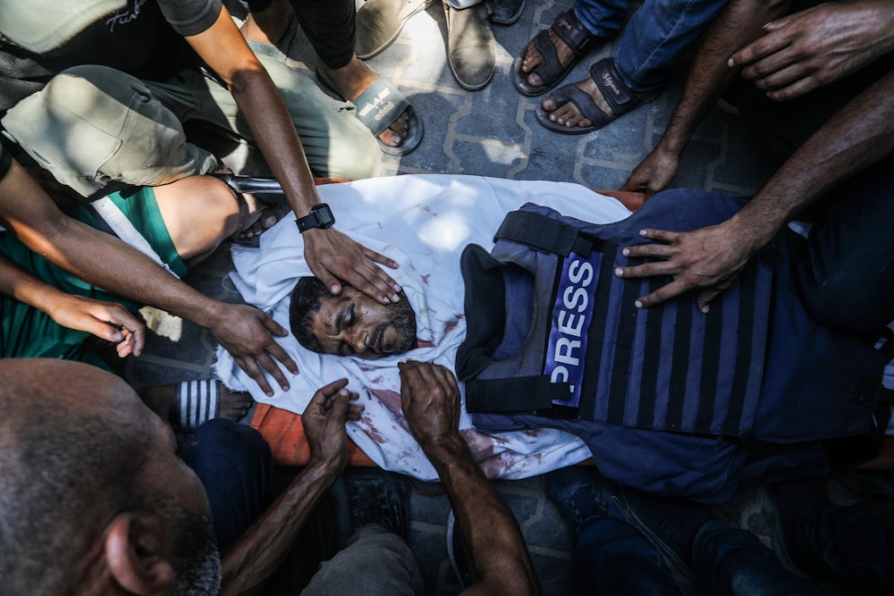 A funeral ceremony was held Monday in the courtyard of Nasser Hospital for four journalists killed in an Israeli attack