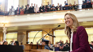 New Jersey Governor Mikie Sherrill smiles as she speaks to the state legislature.