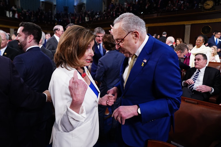 Speaker Emerita Nancy Pelosi speaks to Senator Chuck Schumer ahead of President Joe Biden’s last State of the Union