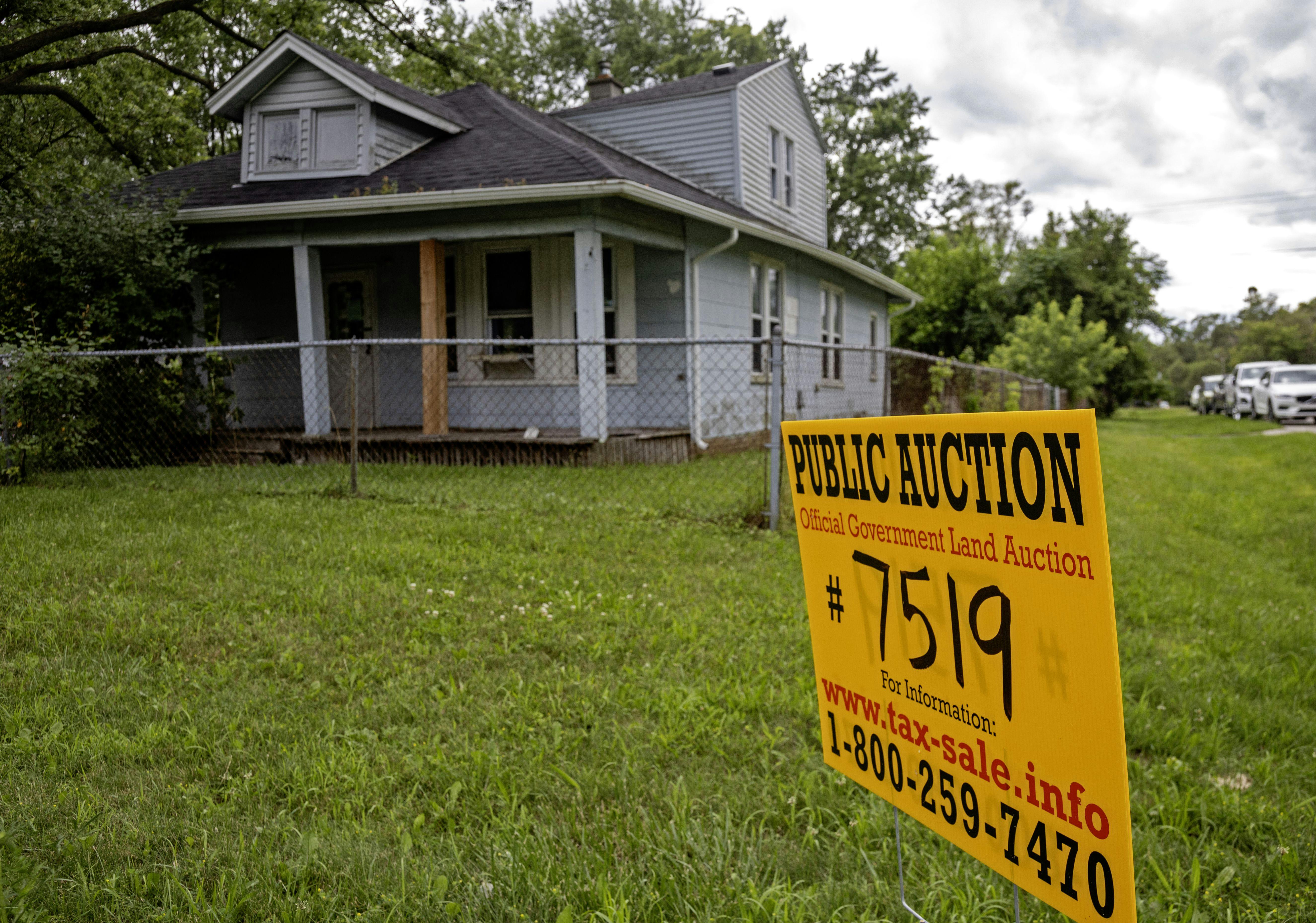Southfield, Michigan, A sign advertises the upcoming online auction of a home foreclosed because of nonpayment of taxes.