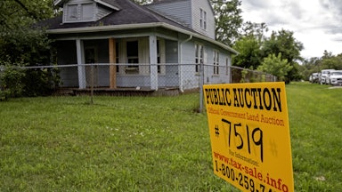 Southfield, Michigan, A sign advertises the upcoming online auction of a home foreclosed because of nonpayment of taxes.