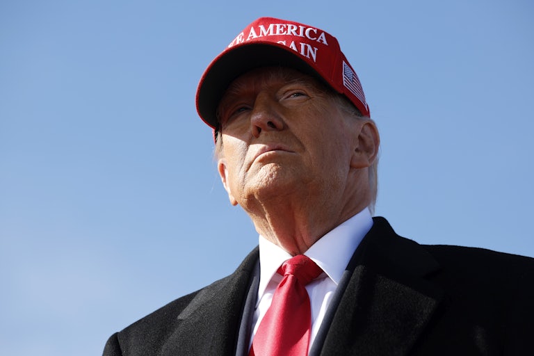 Donald Trump wearing a “Make America Great Again” hat