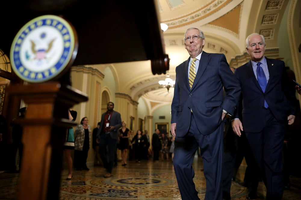 Mitch McConnell and John Cornyn prepare to talk with reporters.