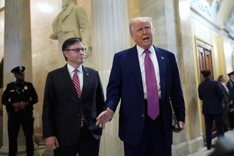 Donald Trump and Mike Johnson speak to reporters in the Capitol about their budget bill.