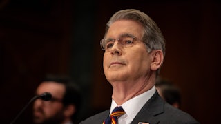 Treasury Secretary Scott Bessent sits in a Senate hearing