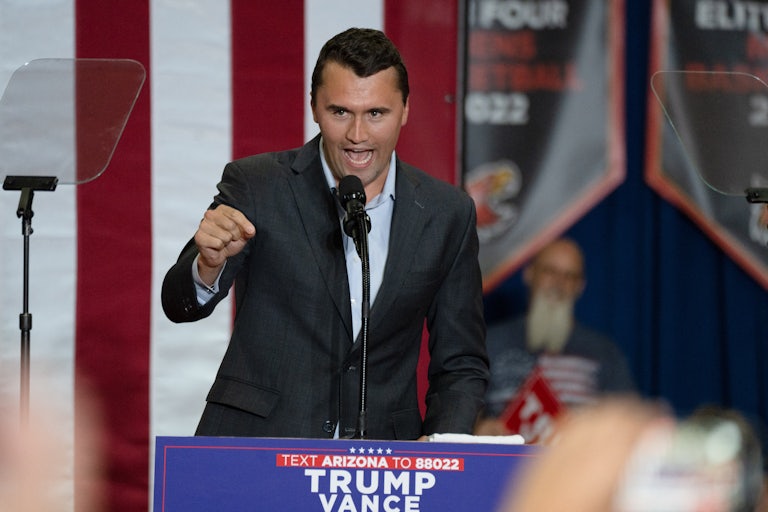 Charlie Kirk gestures while speaking at a Donald Trump campaign event