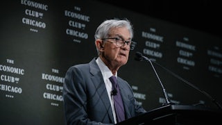 Federal Reserve chair Jerome Powell stands behind a podium while speaking at an event at the Economic Club of Chicago.