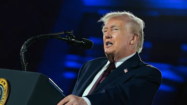 President Donald Trump speaking at a podium