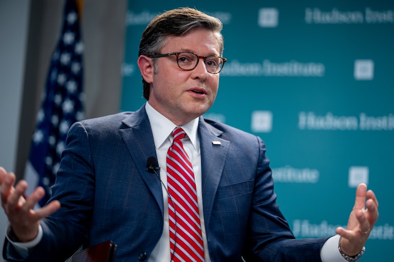 Mike Johnson gestures as he speaks