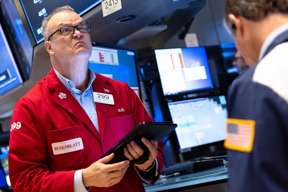 Traders work on the floor of the New York Stock Exchange during morning trading on April 03, 2025 in New York City.
