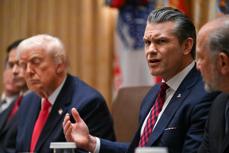 Pete Hegseth speaks in a meeting with Donald Trump.