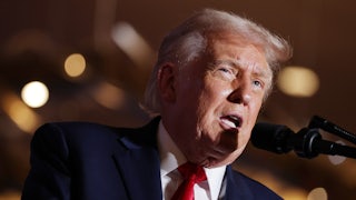 Donald Trump speaking into a microphone