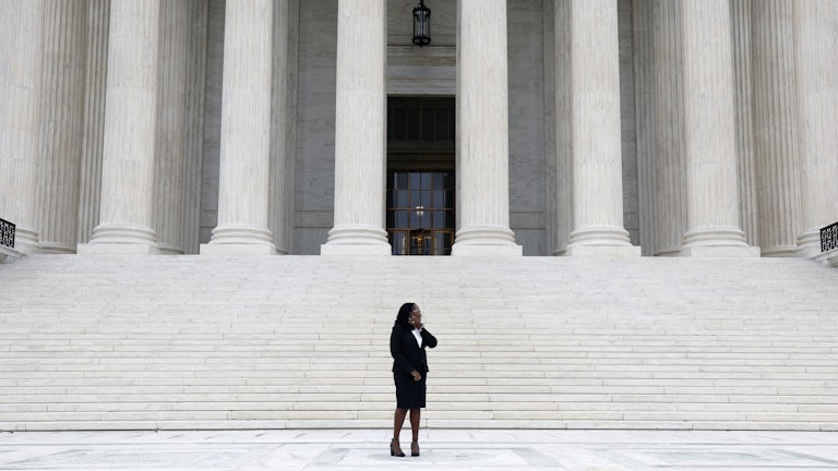Associate Justice Ketanji Brown Jackson stands for a photo on the steps of the Supreme Court during her investiture ceremony.