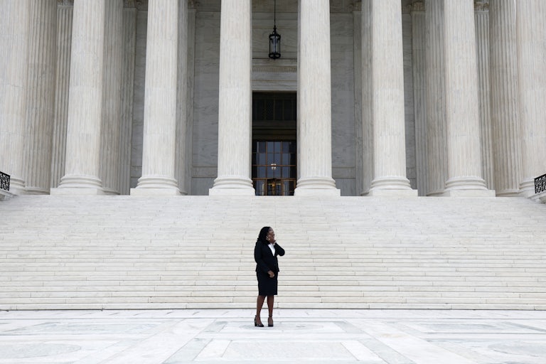 Associate Justice Ketanji Brown Jackson stands for a photo on the steps of the Supreme Court during her investiture ceremony.