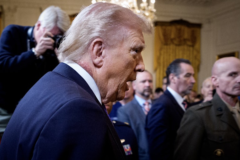 President Donald Trump arrives for a Medal of Honor Ceremony, as his rash peeks out from his collar.