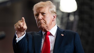 Trump points at camera