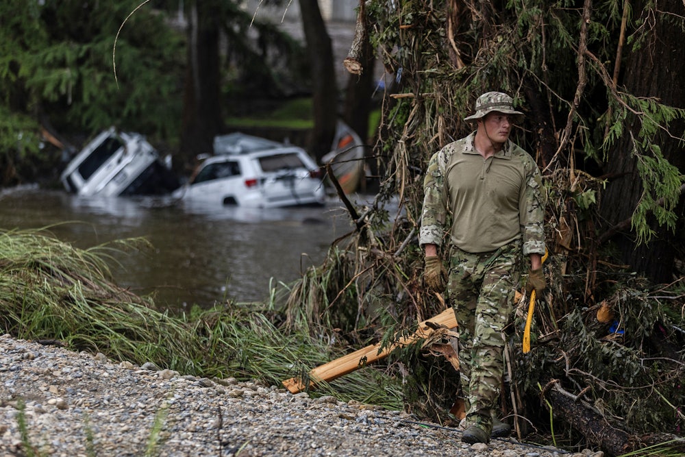 On July 6, a search-and-rescue worker looked through debris for any survivors of the Guadalupe River flooding in Hunt, Texas.