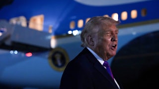 Donald Trump speaks while standing next to Air Force One