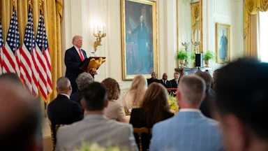 Donald Trump delivers a speech at the White House.