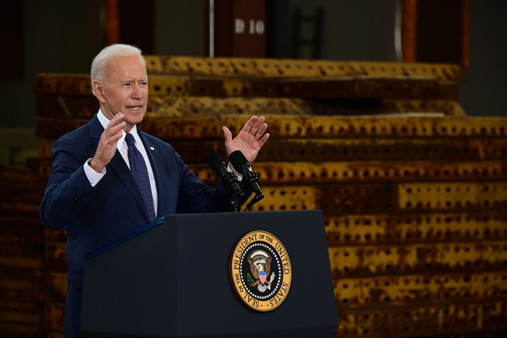Joe Biden speaks at a podium.