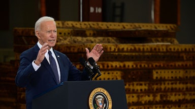 Joe Biden speaks at a podium.