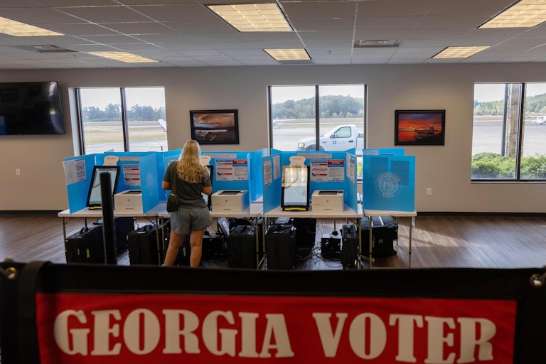 A person votes at a polling station in Georgia