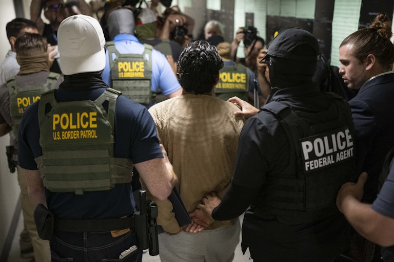 ICE agents detain someone at immigration court in New York City