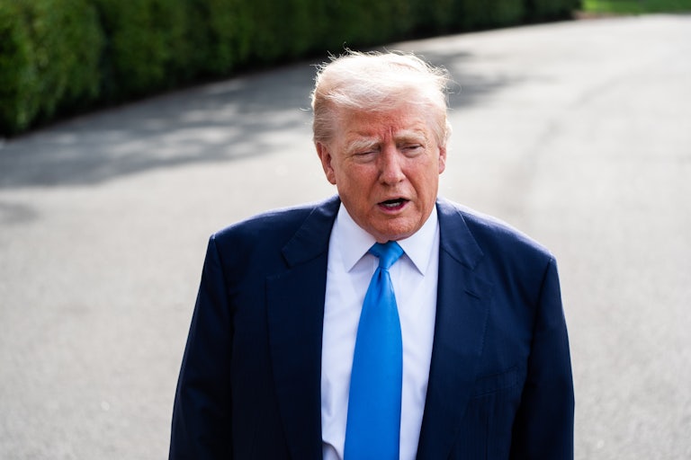 Donald Trump speaks to reporters outside the White House