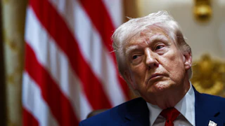 Donald Trump stares tiredly