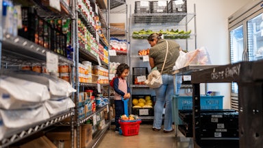 A family gathers food in the community pantry at the Central Texas Food Bank on March 26, 2025 in Austin, Texas.